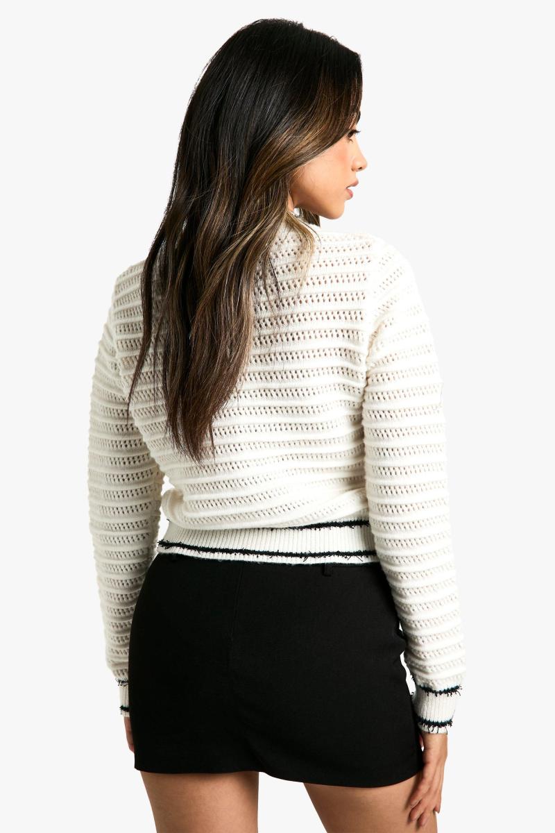 В'язаний кардиган з контрастними деталями букле